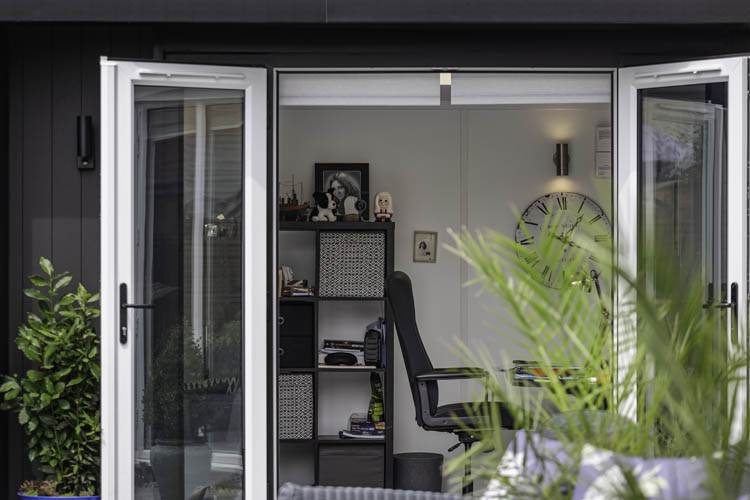 Exterior of a TGO3 home office with both french door open