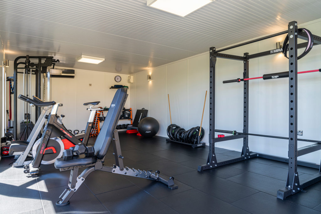 Interior of a home gym with gym equipment inside